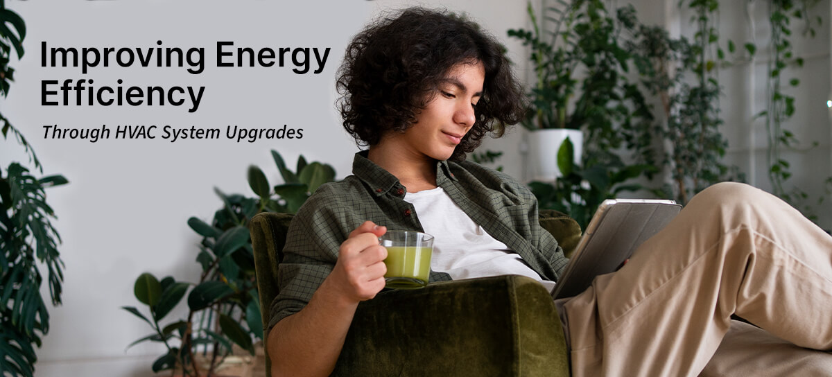 Man sitting in living room while drinking matcha. Plant filled living room in the background. "Improving Energy Efficiency through HVAC System Upgrades"